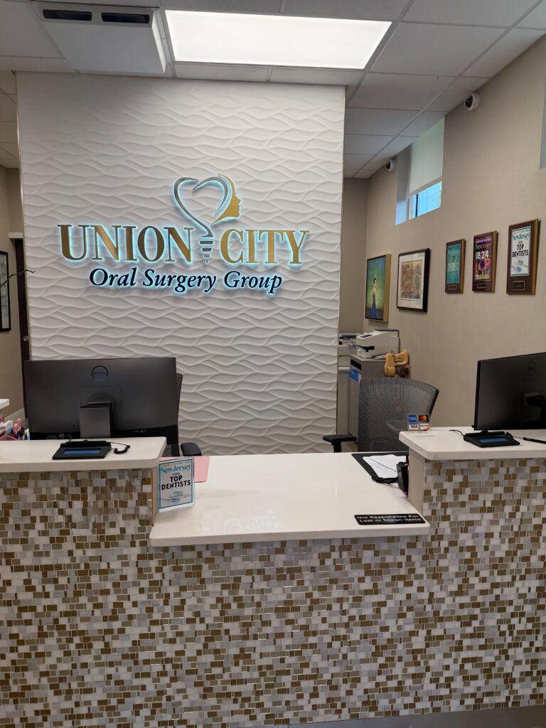 Union City Oral Surgery Group reception area with clinical signage and multiple workstations